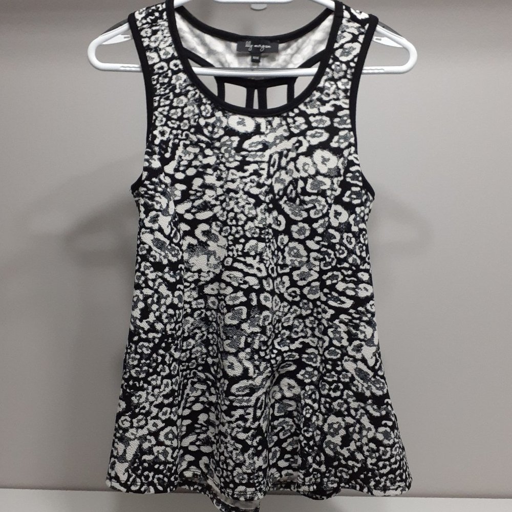 Black and white top with attractive strapping on back